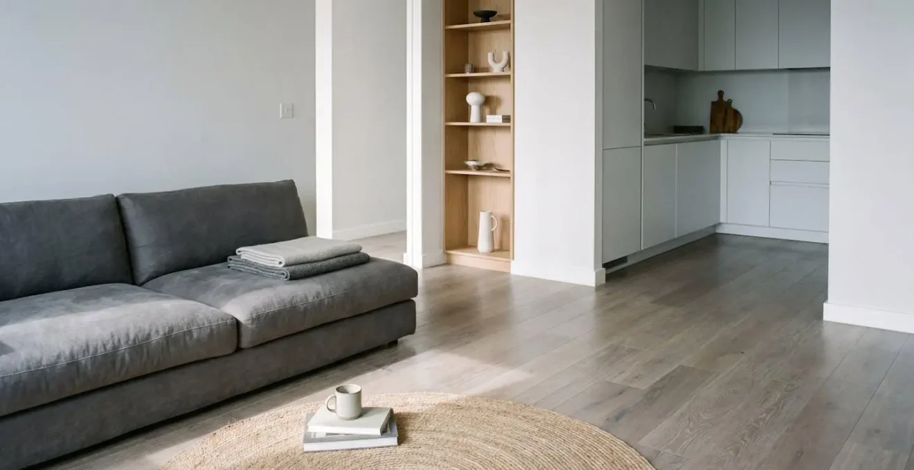 Modern leasehold apartment interior with personal belongings and fixtures showing the distinction between building and contents coverage